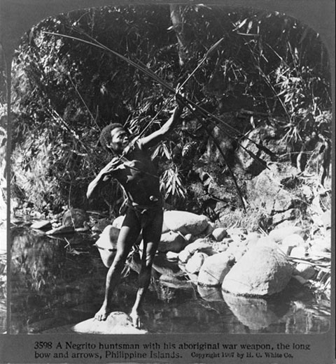 A Negrito huntsman with his Aboriginal War Weapon, the Long Bow and Arrows, Philippine Islands