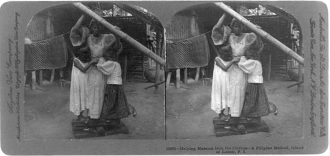 Helping Mama Iron the Clothes—a Filipino Method, Island of Luzon, P.I.